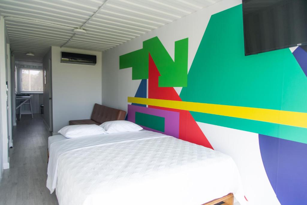 Postel nebo postele na pokoji v ubytování Nomada Republic Hotel Punta Chame