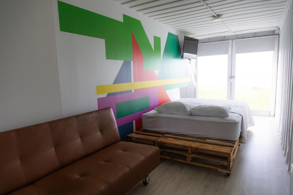 Postel nebo postele na pokoji v ubytování Nomada Republic Hotel Punta Chame