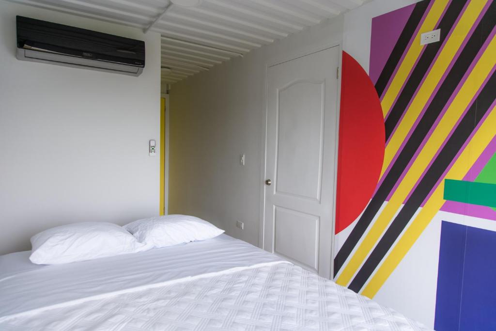 Postel nebo postele na pokoji v ubytování Nomada Republic Hotel Punta Chame