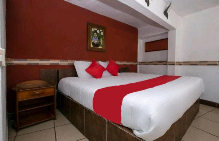 Postel nebo postele na pokoji v ubytování Hotel Real Cortés