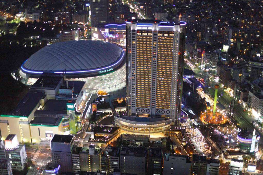 an aerial view of a city at night at Tokyo Dome Hotel in Tokyo