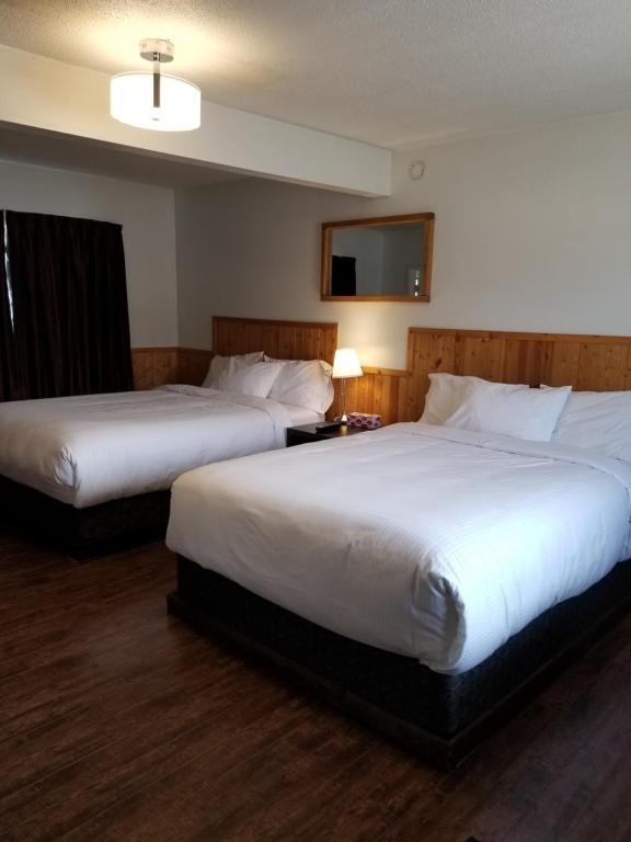 Postel nebo postele na pokoji v ubytování Sun Plaza Motel