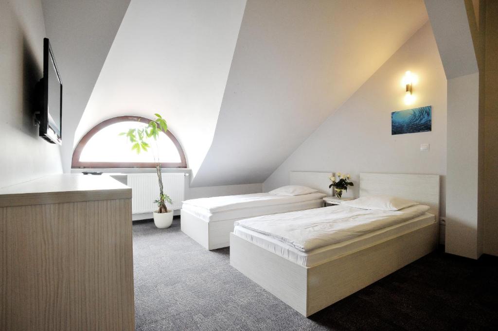 Postel nebo postele na pokoji v ubytování Hostel Promenada