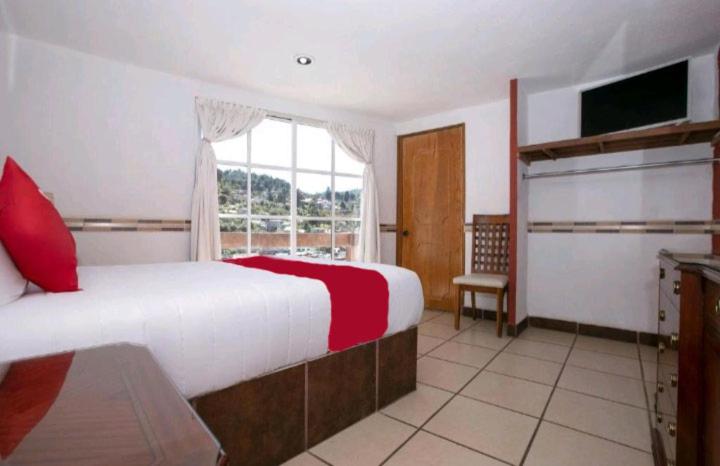 Postel nebo postele na pokoji v ubytování Hotel Real Cortés