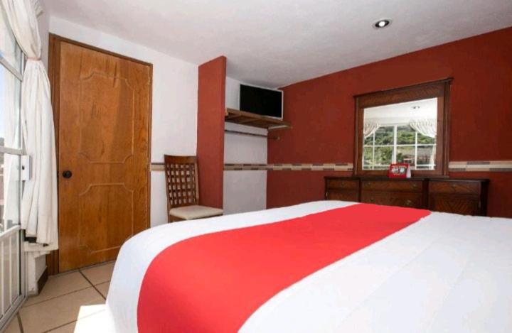 Postel nebo postele na pokoji v ubytování Hotel Real Cortés