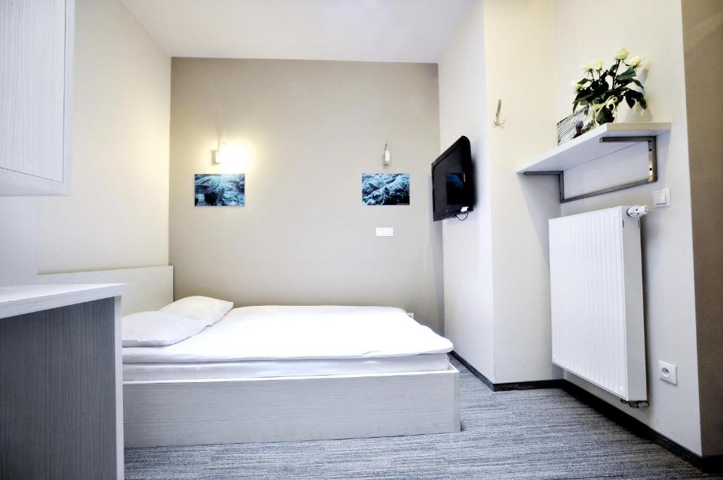 Postel nebo postele na pokoji v ubytování Hostel Promenada