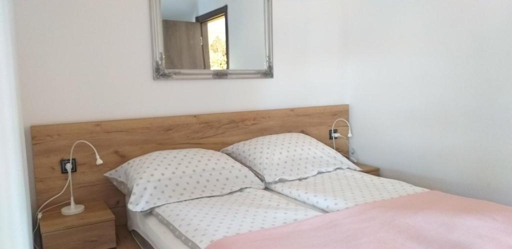 Postelja oz. postelje v sobi nastanitve apartman SUPERKLASIKO