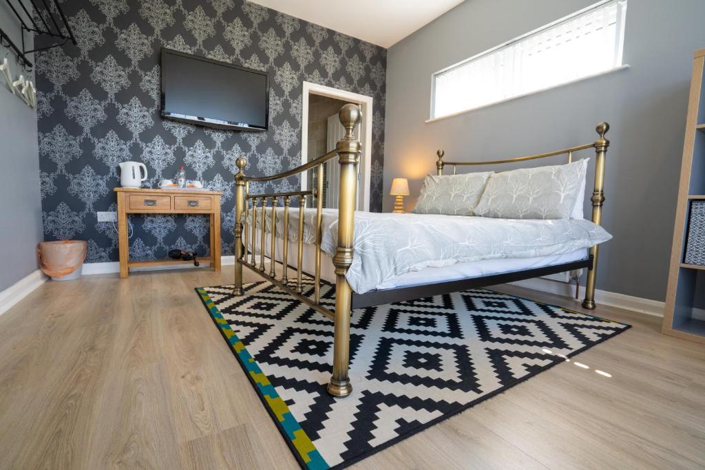 A bed or beds in a room at Rest a While