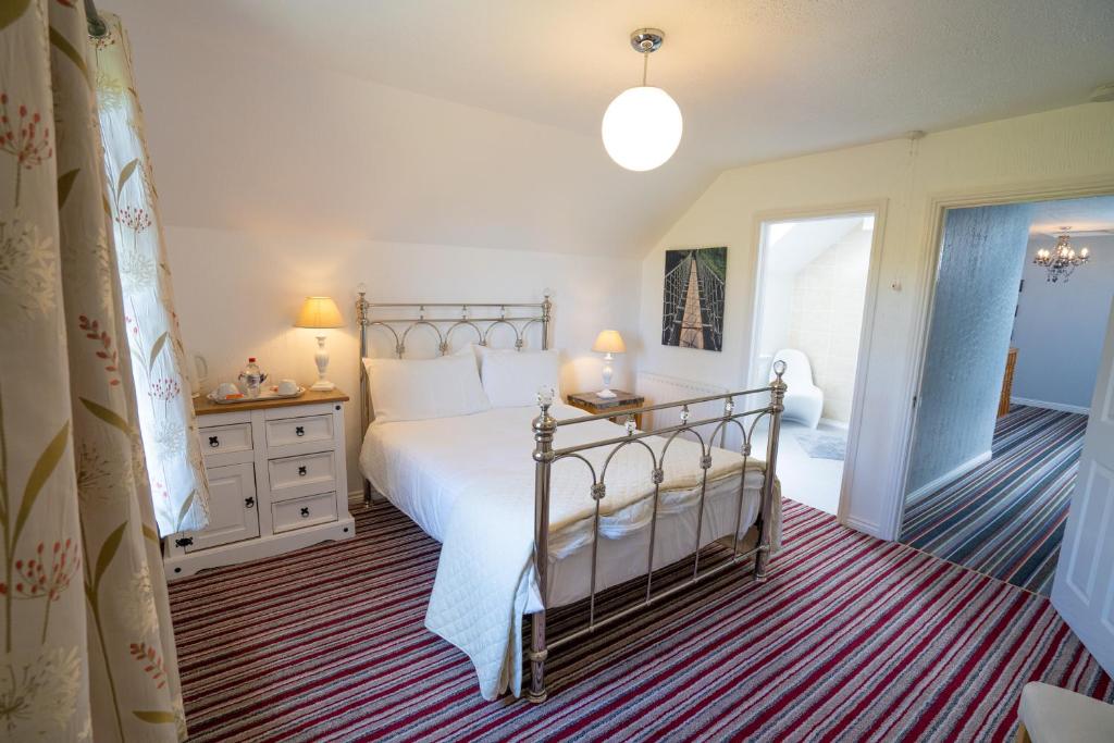 A bed or beds in a room at Rest a While
