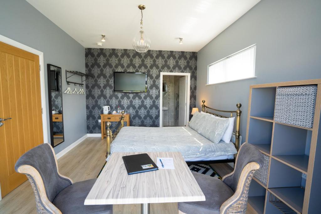 A bed or beds in a room at Rest a While