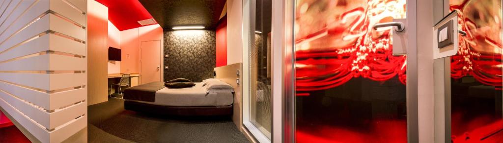 Łóżko lub łóżka w pokoju w obiekcie Pineta Hotel