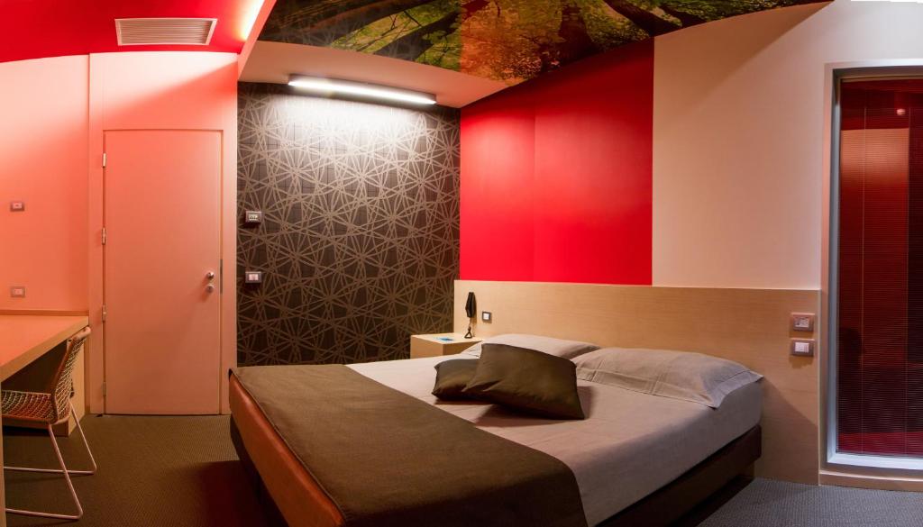 Łóżko lub łóżka w pokoju w obiekcie Pineta Hotel