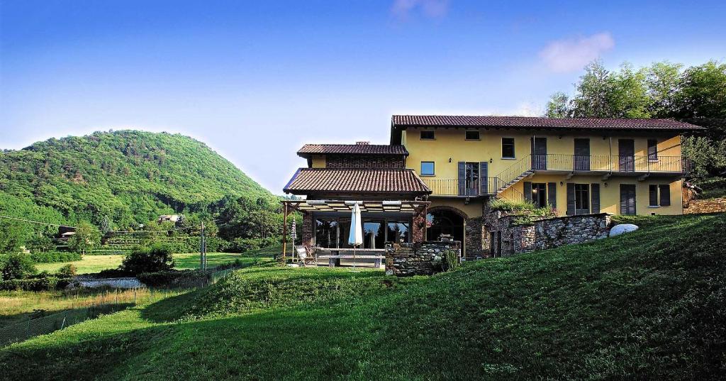 a house on the side of a hill at Cascina Canée in Angera