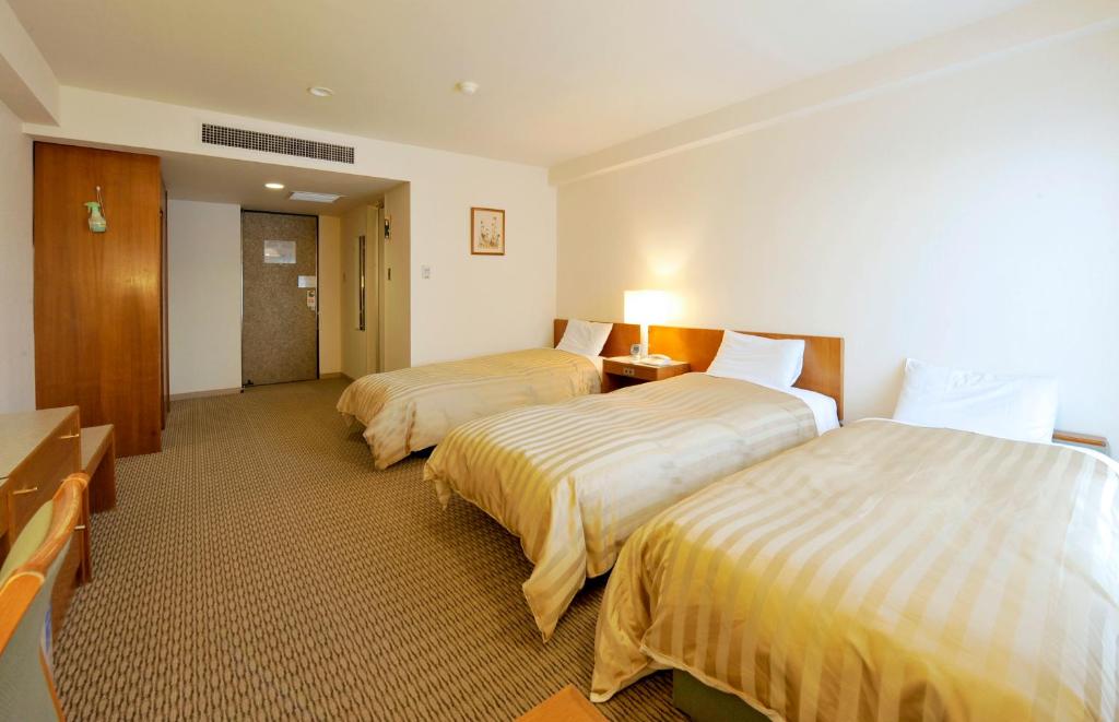 Postel nebo postele na pokoji v ubytování Hotel Gimmond Kyoto