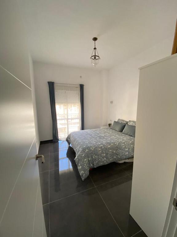 Posteľ alebo postele v izbe v ubytovaní CASA REFORMADA CON TERRAZA/WIFI/AIRE ACONDICIONADO