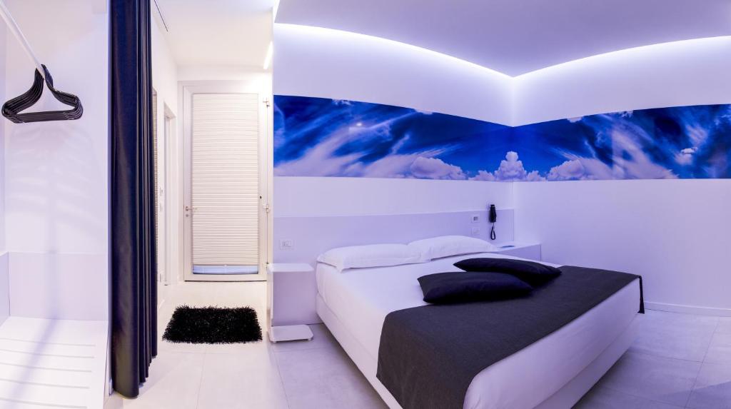 Łóżko lub łóżka w pokoju w obiekcie Pineta Hotel