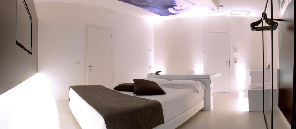 Łóżko lub łóżka w pokoju w obiekcie Pineta Hotel