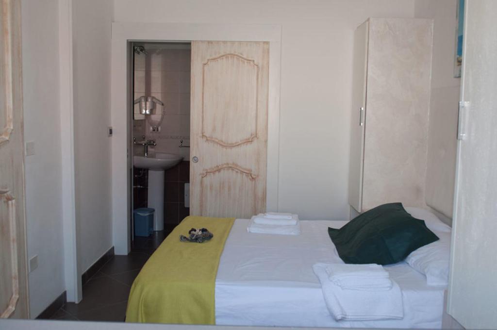 Postel nebo postele na pokoji v ubytování Baia Di Torre Squillace