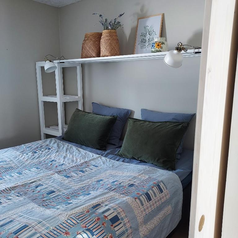 Postel nebo postele na pokoji v ubytování Lustrup Farmhouse