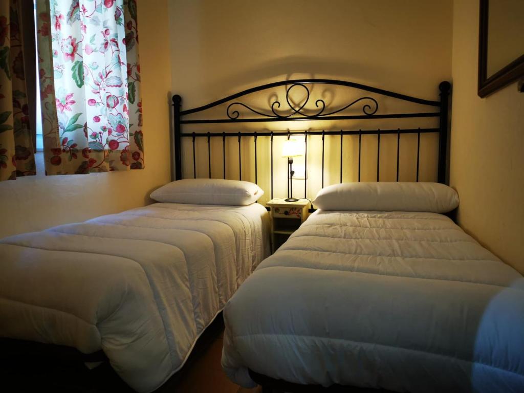 מיטה או מיטות בחדר ב-IMEDA Apartamento SALVIA
