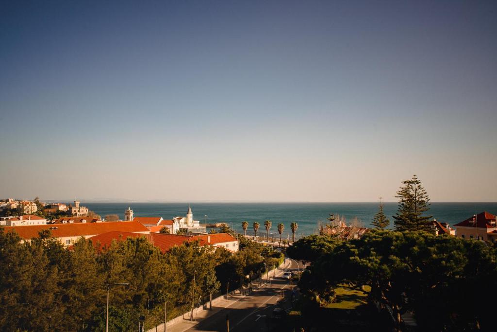 a view of a city with the ocean in the background at A House in Estoril - Adults Only in Estoril