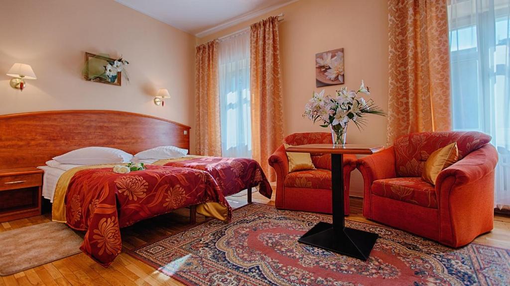Posteľ alebo postele v izbe v ubytovaní Hotel Restauracja Caspar