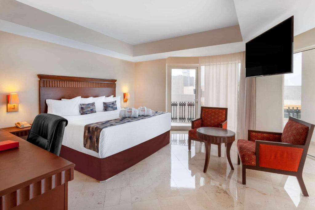 Postel nebo postele na pokoji v ubytování Ramada Plaza by Wyndham Veracruz Boca del Rio