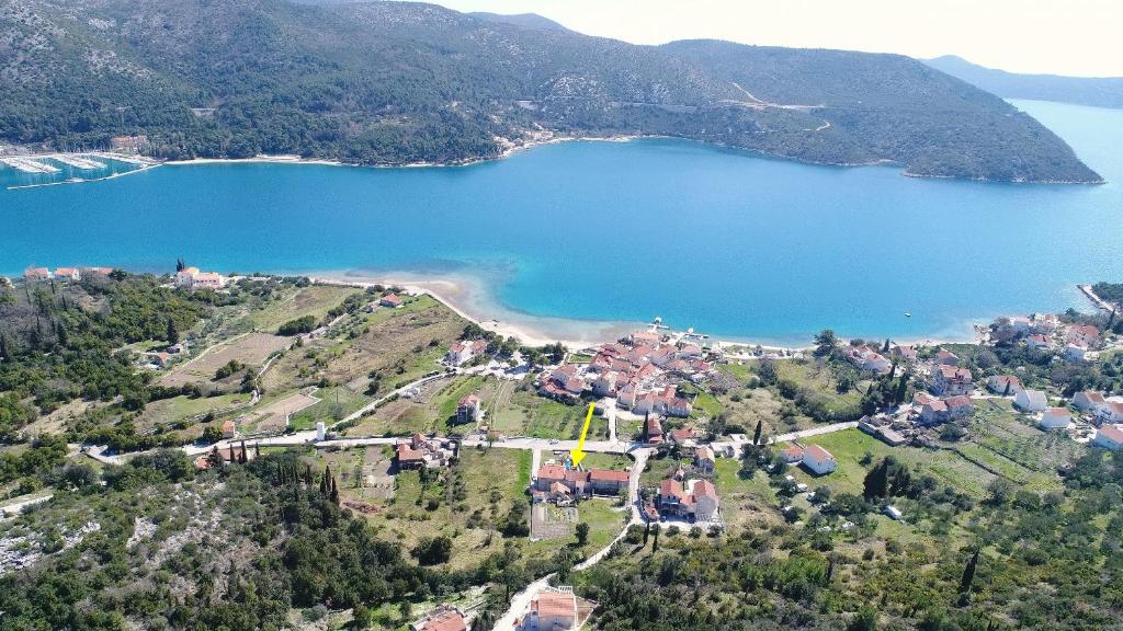 an aerial view of a village and a lake at Apartment Lepur Slano in Slano