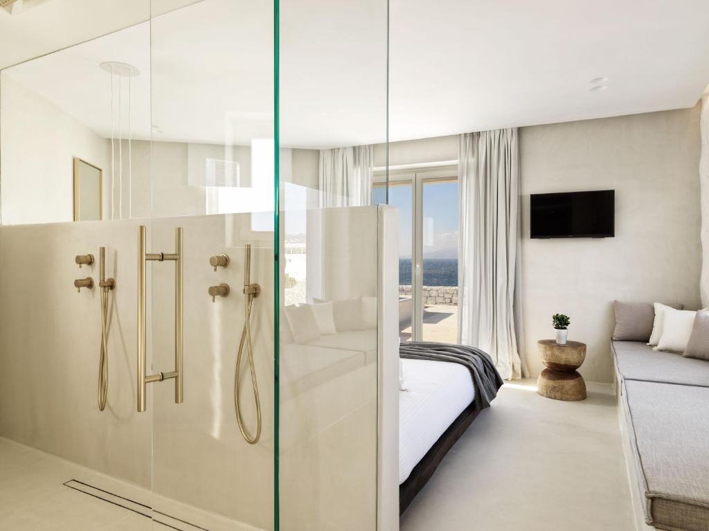 A bed or beds in a room at Mykonos Earth Suites