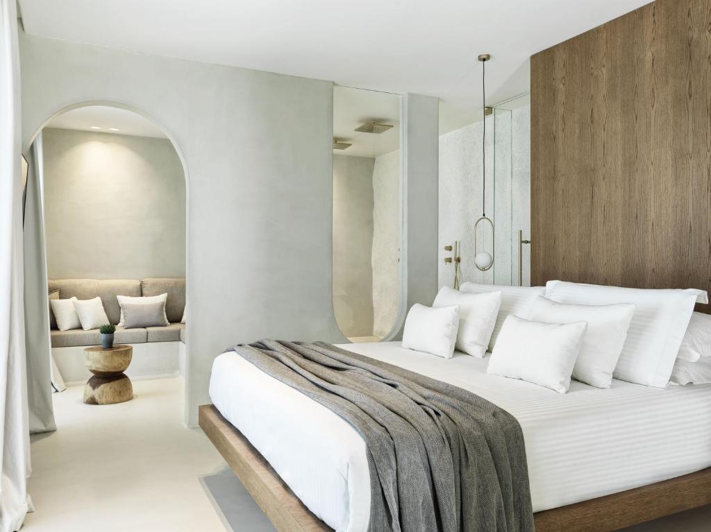 A bed or beds in a room at Mykonos Earth Suites