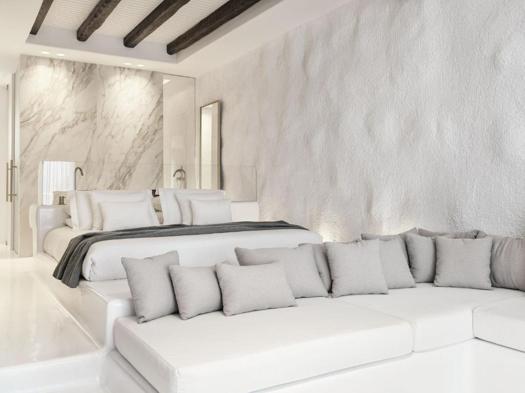 A bed or beds in a room at Mykonos Earth Suites