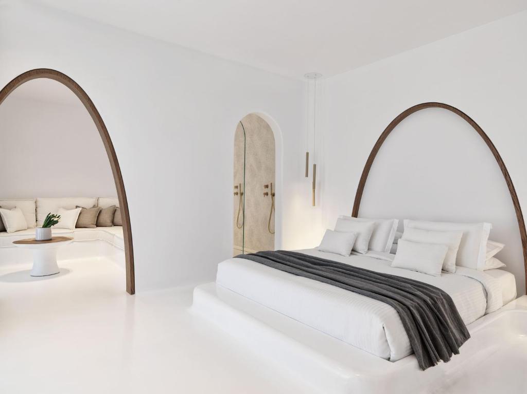 A bed or beds in a room at Mykonos Earth Suites