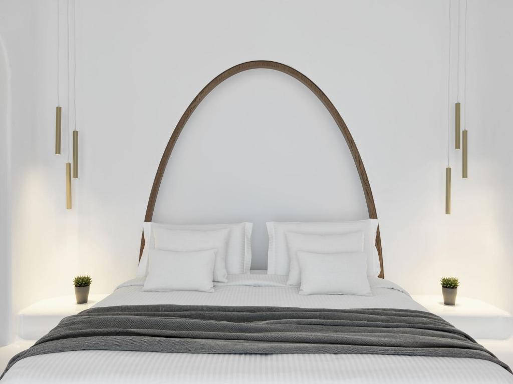 A bed or beds in a room at Mykonos Earth Suites