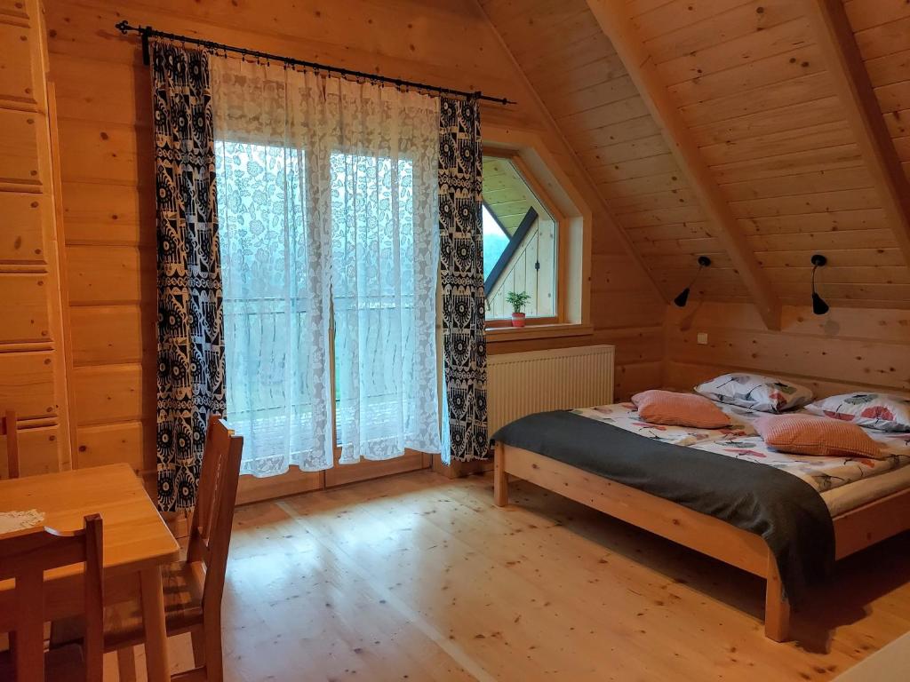 Postel nebo postele na pokoji v ubytování Grażynka