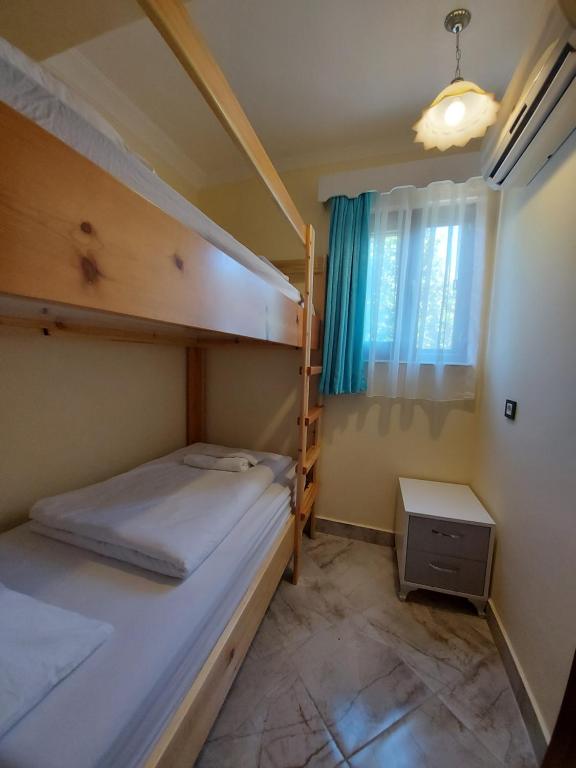 Postel nebo postele na pokoji v ubytování Palm Konak Hotel