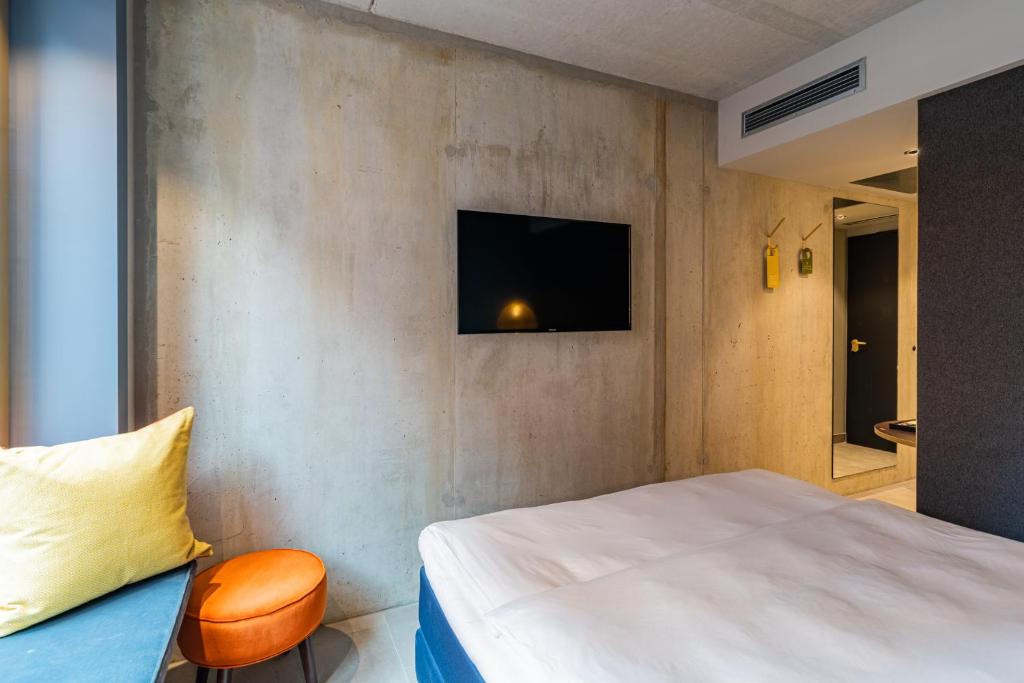 TV a/nebo společenská místnost v ubytování gambino hotel WERKSVIERTEL