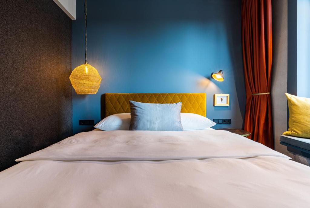 Postel nebo postele na pokoji v ubytování gambino hotel WERKSVIERTEL