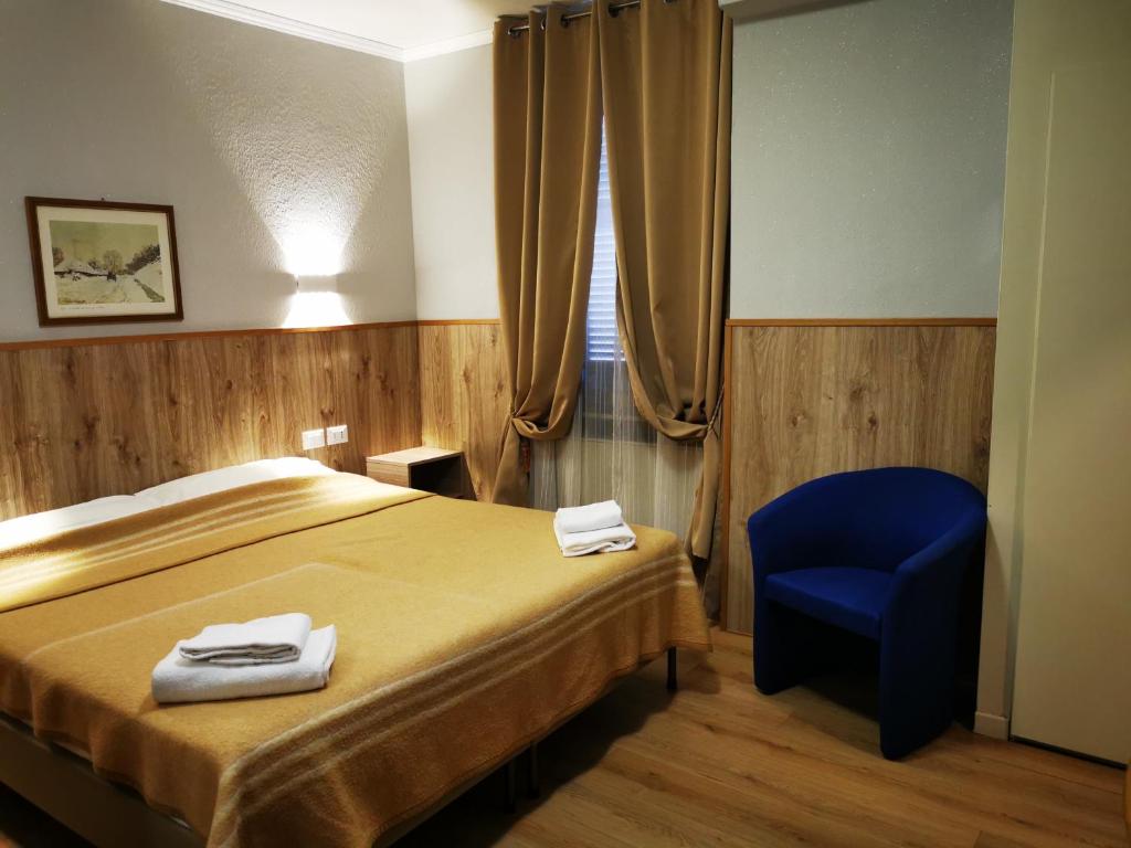 Postel nebo postele na pokoji v ubytování New Alexander Hotel