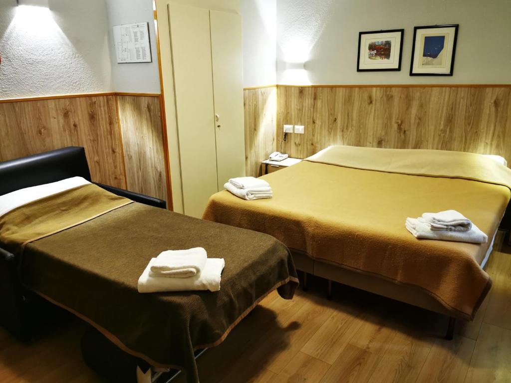 Postel nebo postele na pokoji v ubytování New Alexander Hotel