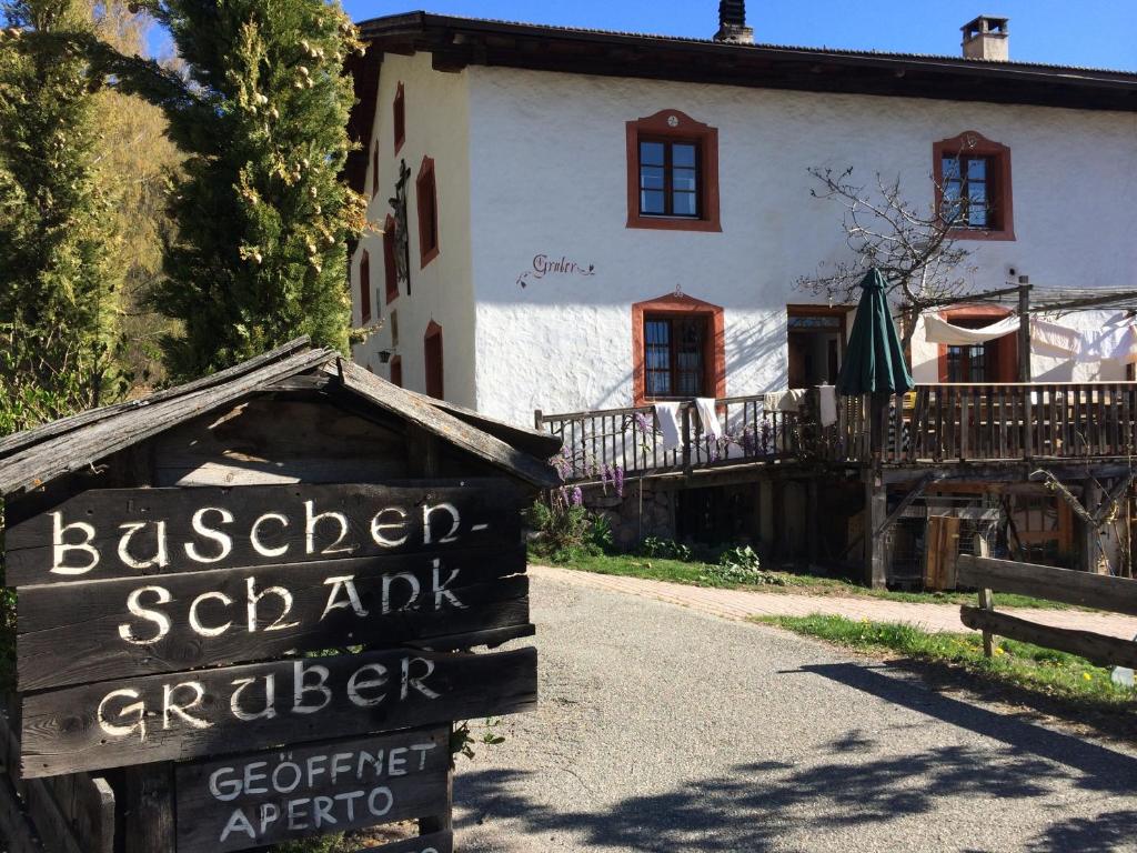 a sign for asteiner schabergerger in front of a house at Gruberhof in San Genesio Atesino