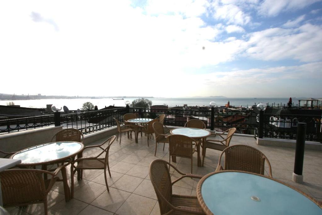 a row of tables and chairs on a roof at Grand Peninsula Hotel in Istanbul