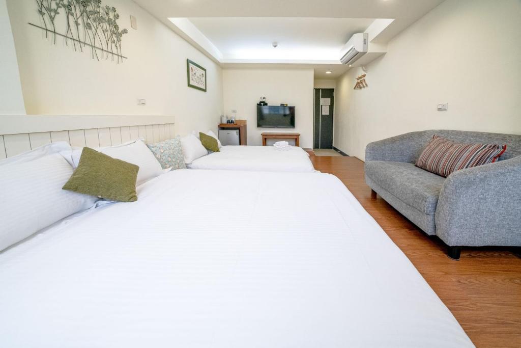 Postel nebo postele na pokoji v ubytování Summer Tree Homestay