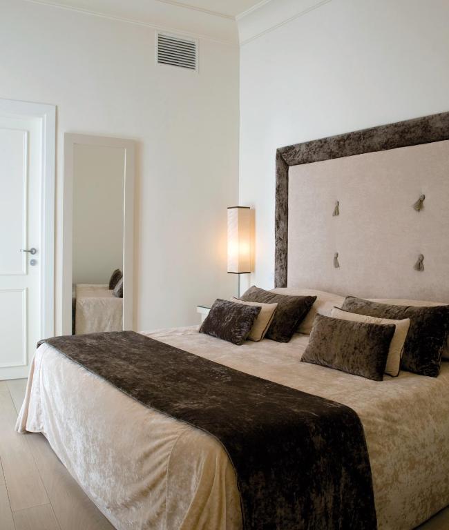 Postel nebo postele na pokoji v ubytování Albergo Palazzo Decumani