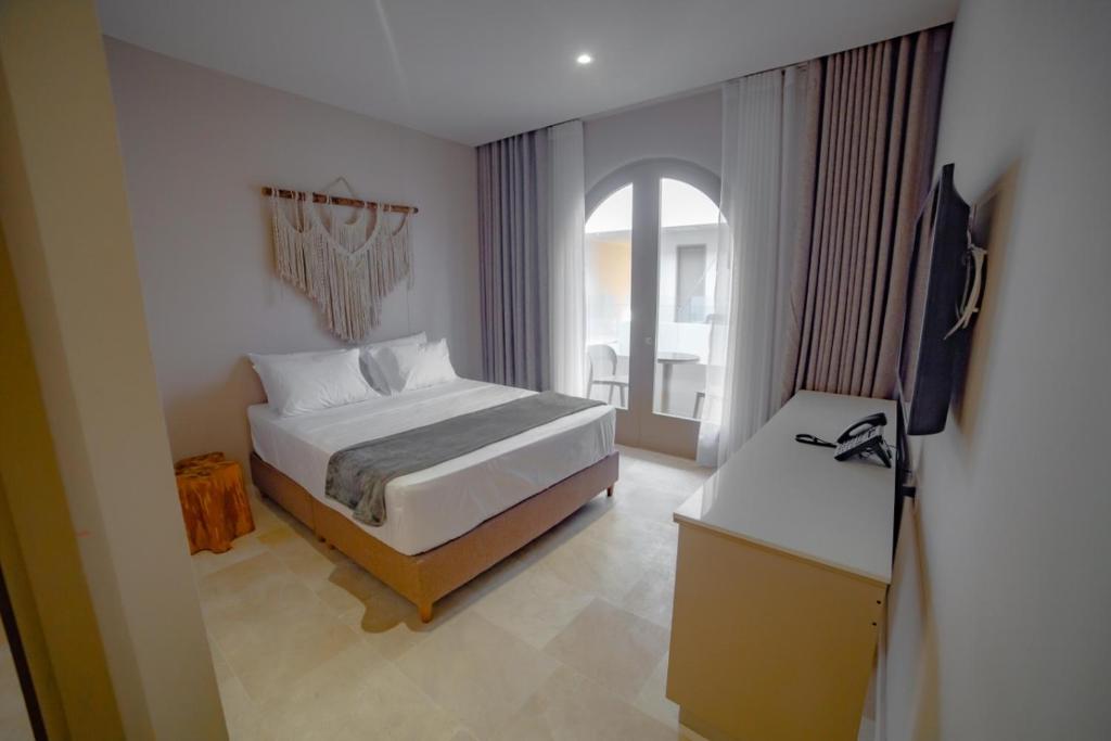 Postel nebo postele na pokoji v ubytování Loa Tolú by Bernalo Hotels