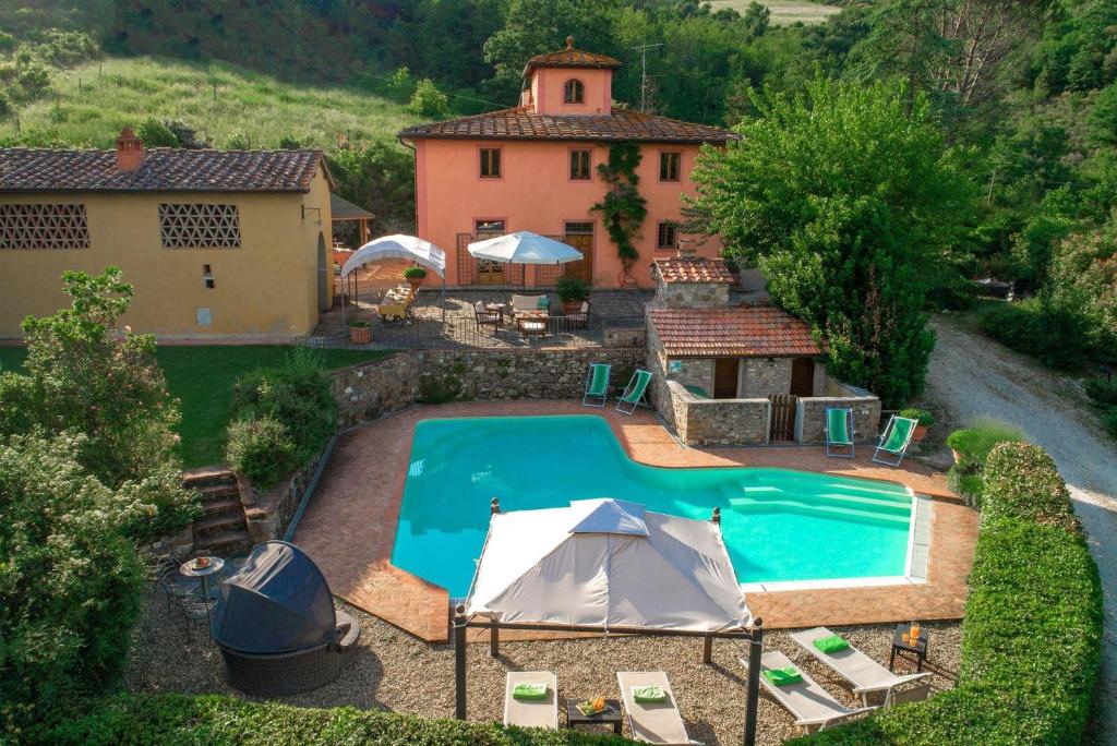 an aerial view of a house with a swimming pool at Casale del Lago in San Casciano in Val di Pesa