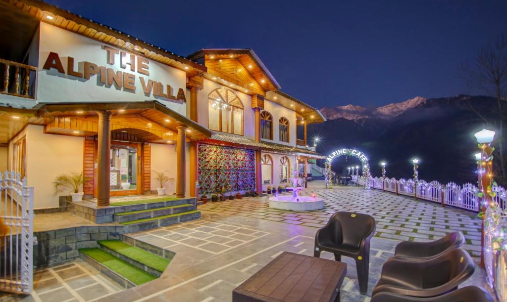 a building at night with lights on it at The Alpine Villa Mcleodganj in McLeod Ganj