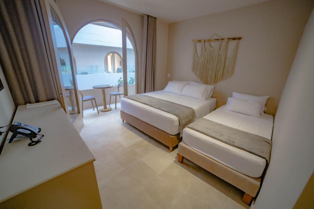 Postel nebo postele na pokoji v ubytování Loa Tolú by Bernalo Hotels