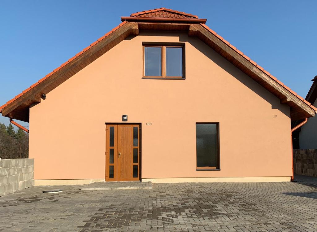 a small house with a red roof at Penzion Čavisov in Čavisov