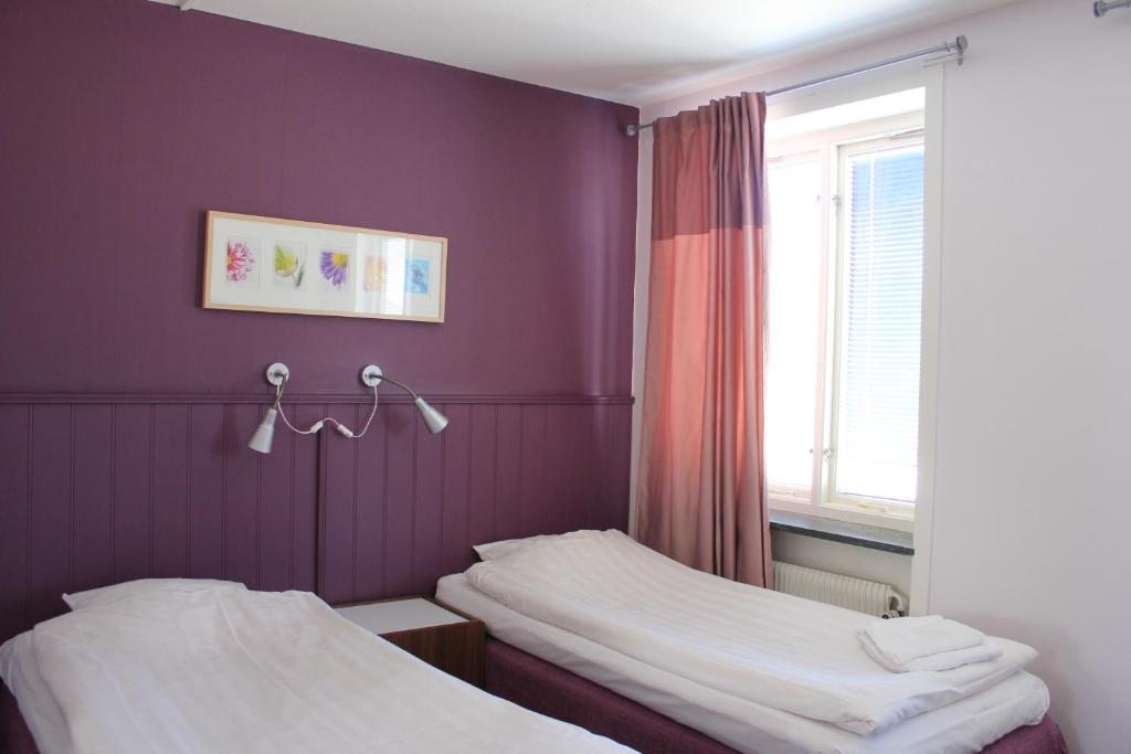Postel nebo postele na pokoji v ubytování Hotel Tre Stockar
