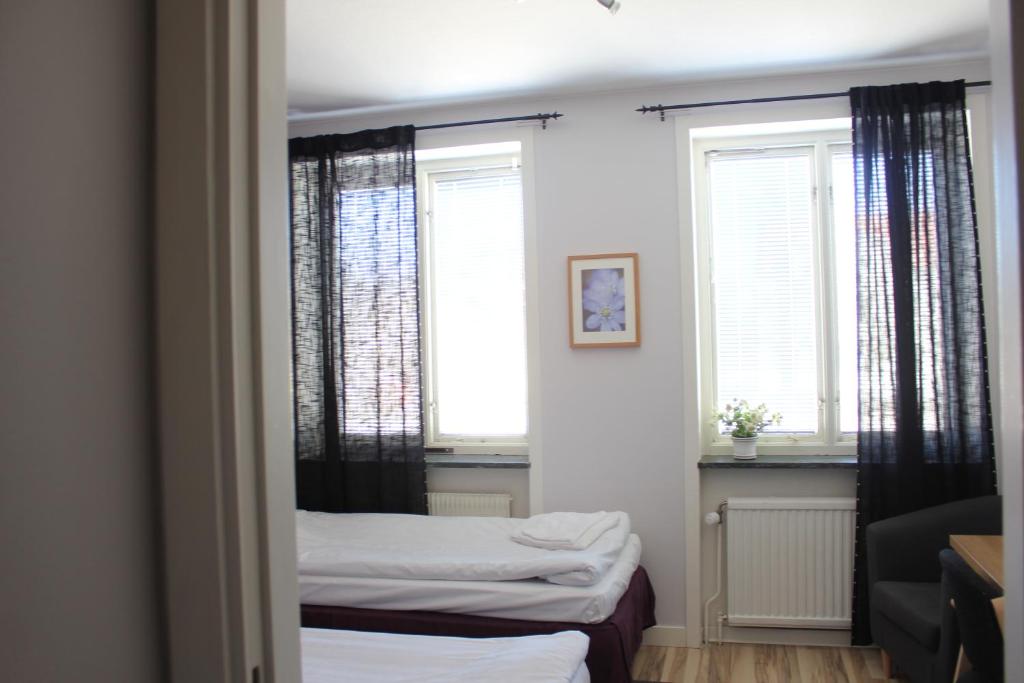 Postel nebo postele na pokoji v ubytování Hotel Tre Stockar